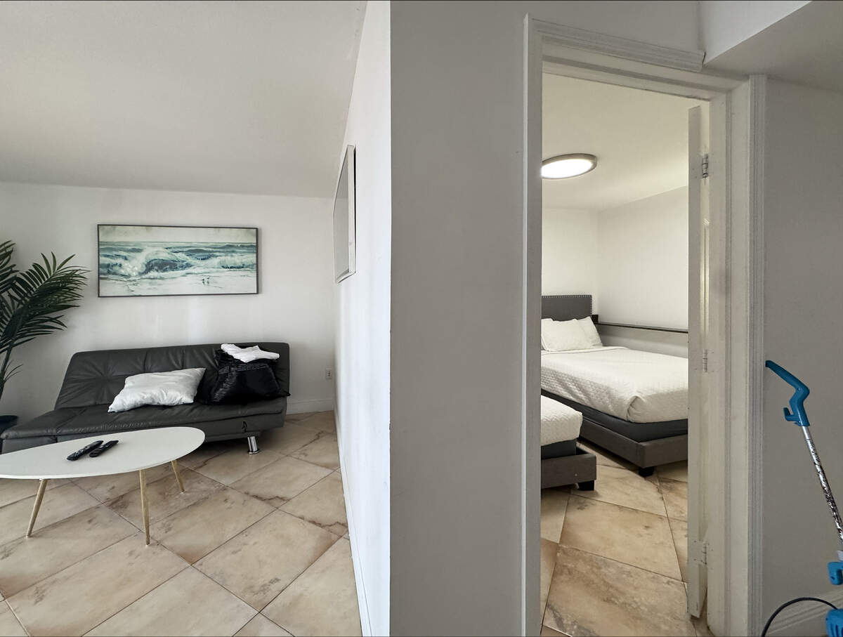 An additional wall erected in a unit at The Club at Brickell Bay adds another bedroom allowing more guests to stay in the condo.